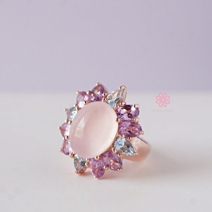 Strahlender Rosenquarzring mit Amethyst und Topas in Sterlingsilber