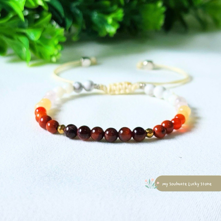 Pulsera de piedras rojas y blancas: Coraje, éxito, equilibrio y suerte.
