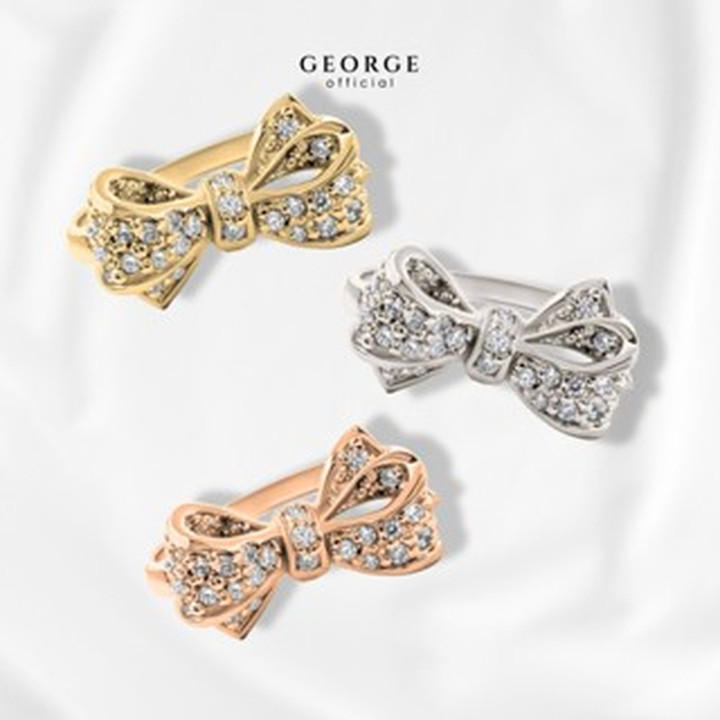 Elegante anillo con lazo: plata de ley, circonita cúbica y baño de oro.