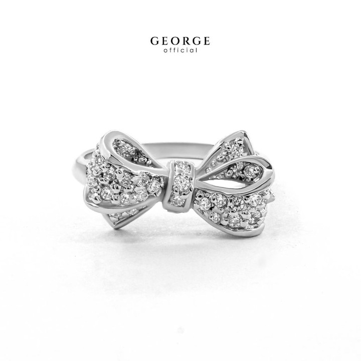 Elegante anillo con lazo: plata de ley, circonita cúbica y baño de oro.